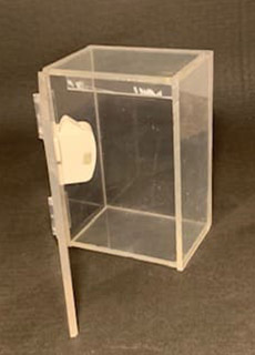 A clear plastic box with a white handle.