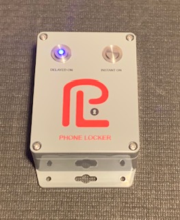 A phone lock box with the light on.