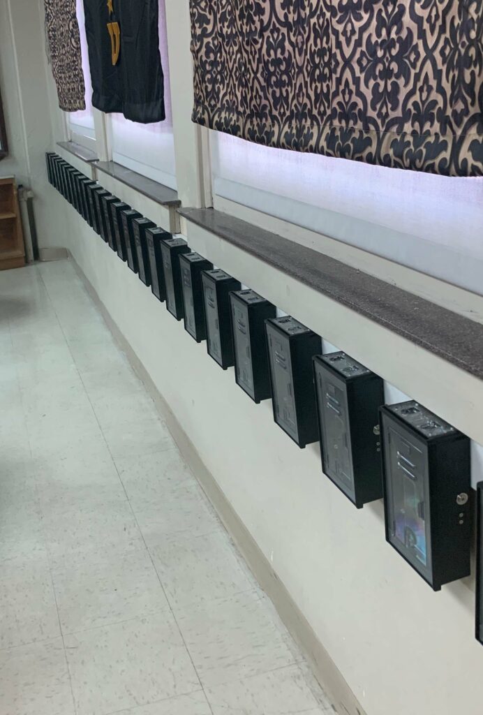A row of black boxes on the wall